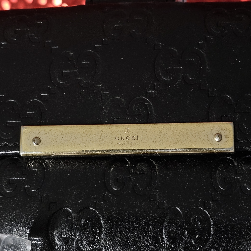 Gucci Black Embossed Clutch with Gold Accent